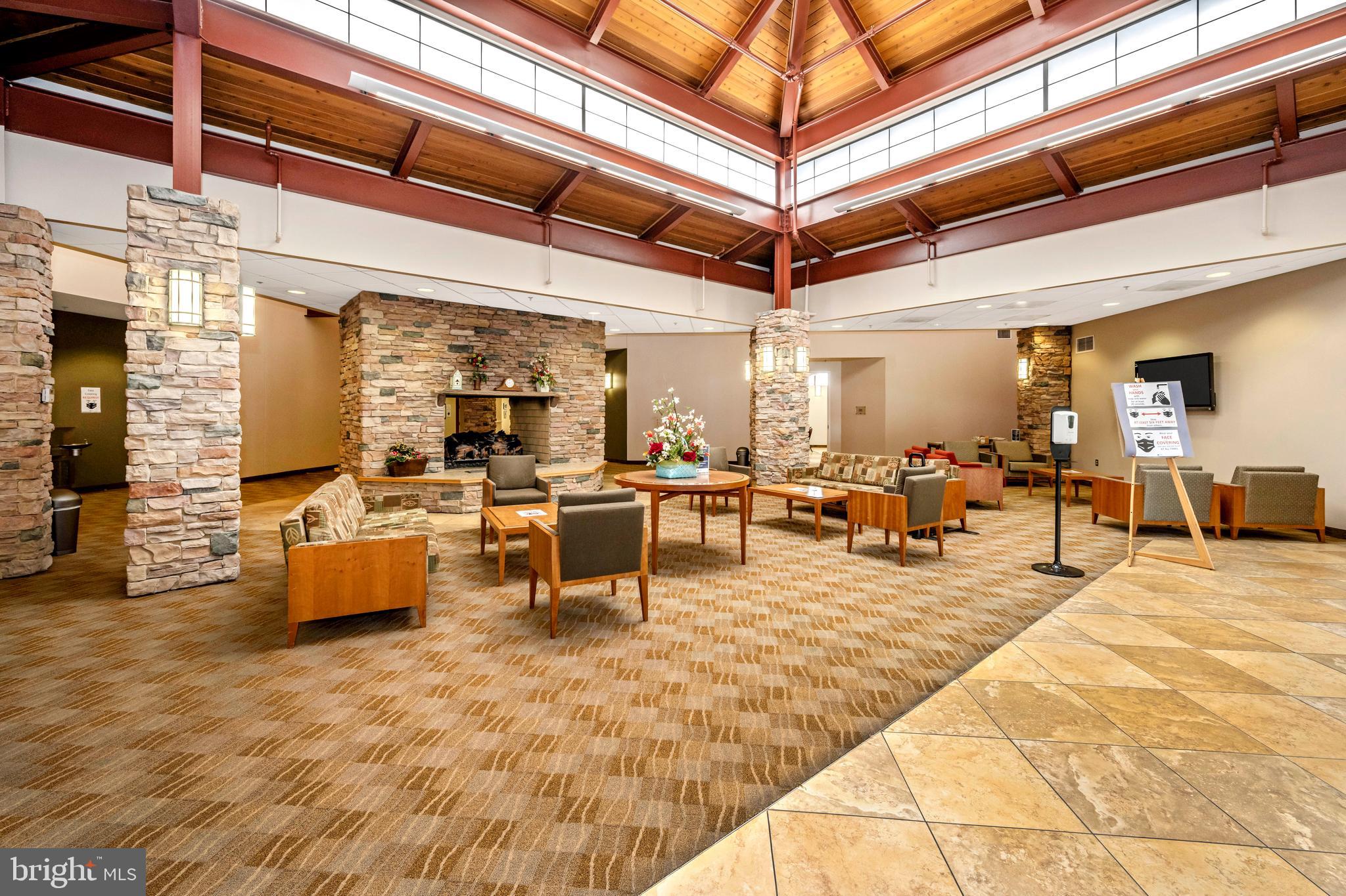 3005 South Leisure World Boulevard, Unit 306 Silver Spring, MD 20906 - Photo 53 of 71 a view of a patio with dining table and chairs with wooden floor