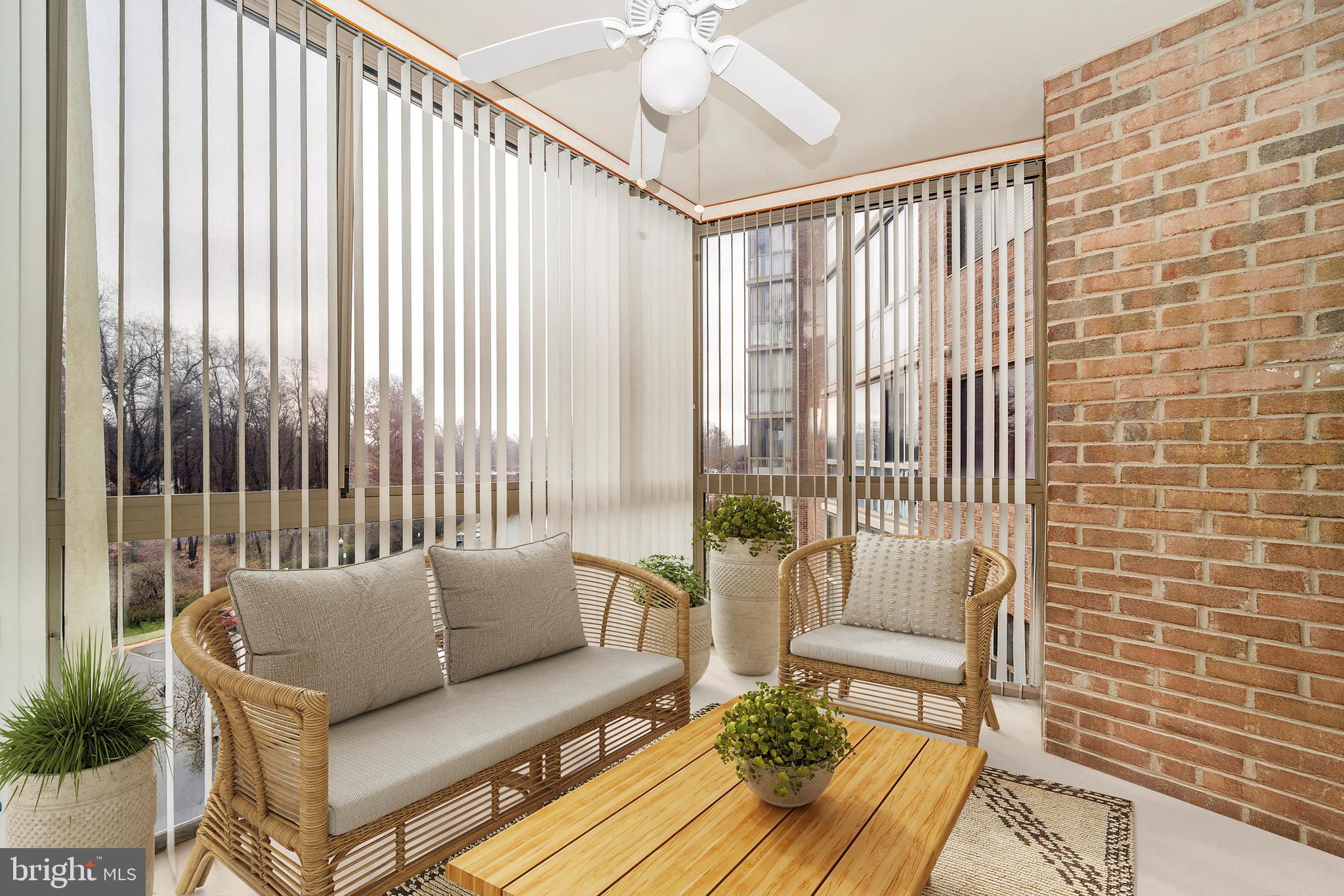 3005 South Leisure World Boulevard, Unit 306 Silver Spring, MD 20906 - Photo 9 of 71 a living room with furniture and a floor to ceiling window