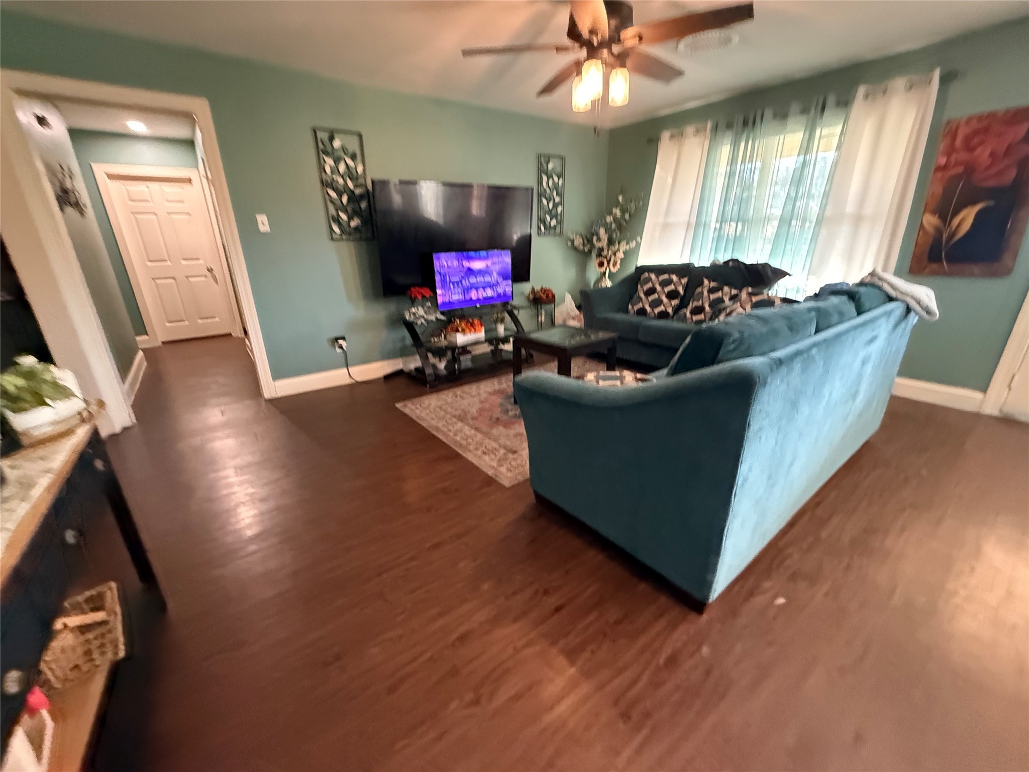 8823 Shadow Crest Street Houston, TX 77074 - Photo 5 of 14 a living room with furniture and a potted plant