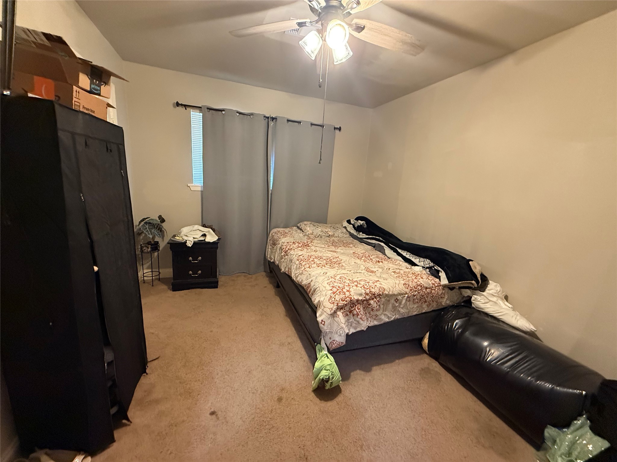 8823 Shadow Crest Street Houston, TX 77074 - Photo 10 of 14 a bedroom with a bed and a chandelier