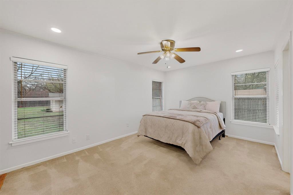 210 North Summit Street Red Oak, TX 75154 - Photo 13 of 24 Primary bedroom has access to the back patio area.