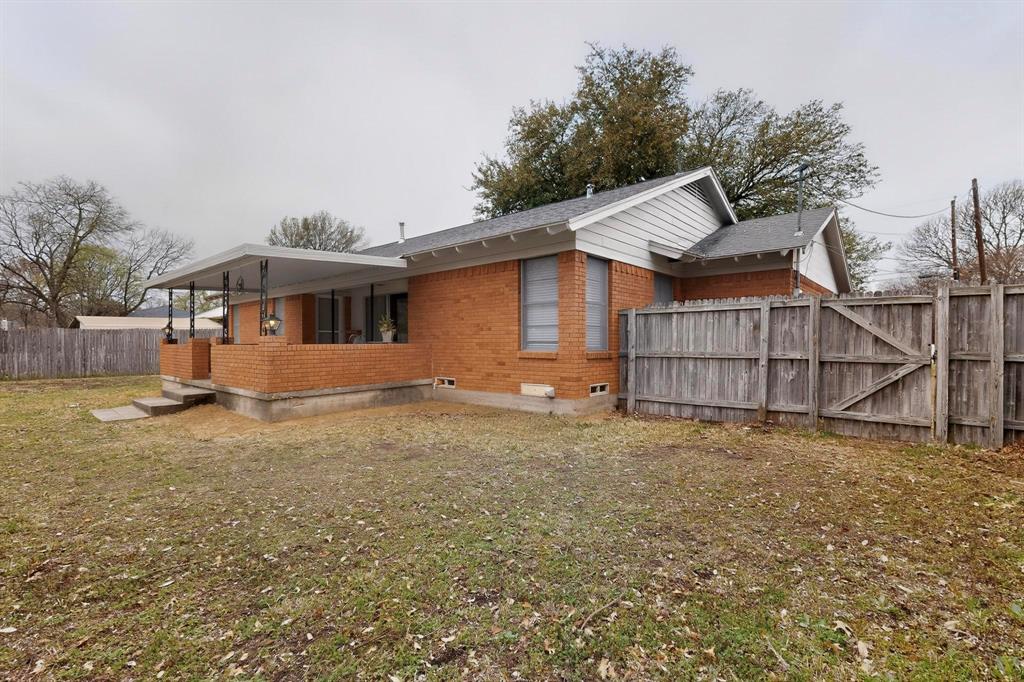 210 North Summit Street Red Oak, TX 75154 - Photo 20 of 24 View of the house from the backyard.