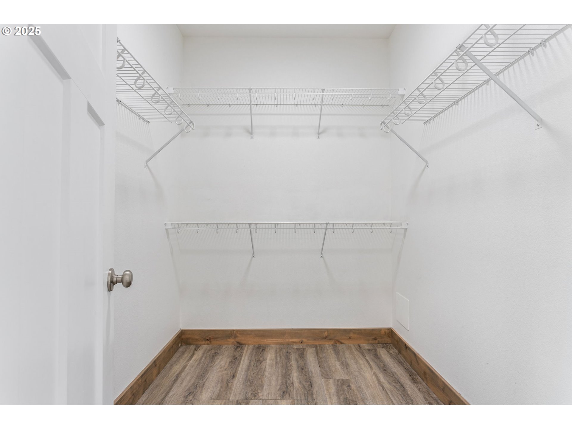5711 Northeast 246th Street Ridgefield, WA 98642 - Photo 17 of 47 a view of a room with racks on the wall