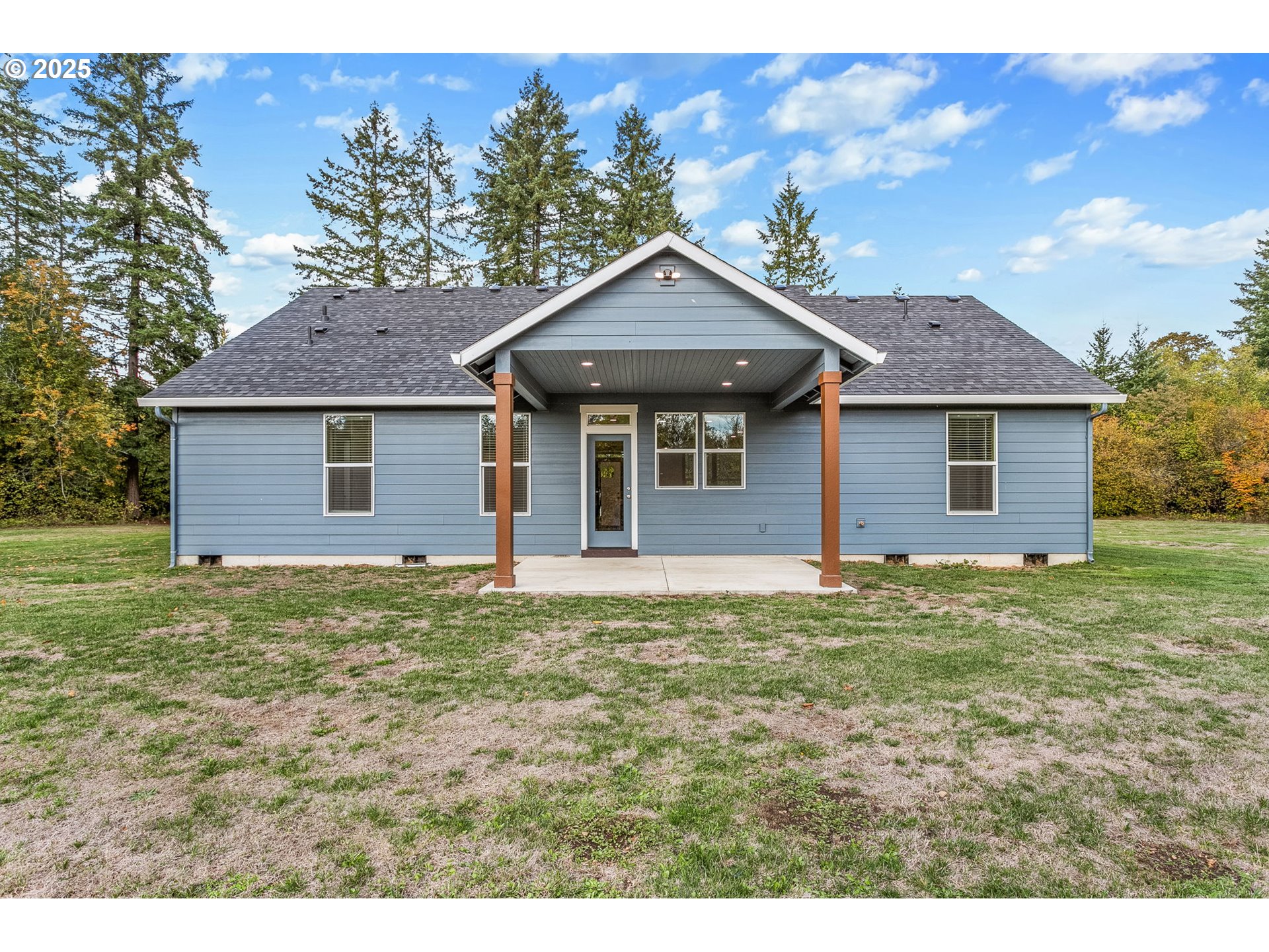 5711 Northeast 246th Street Ridgefield, WA 98642 - Photo 29 of 47 a house with green field in front of it