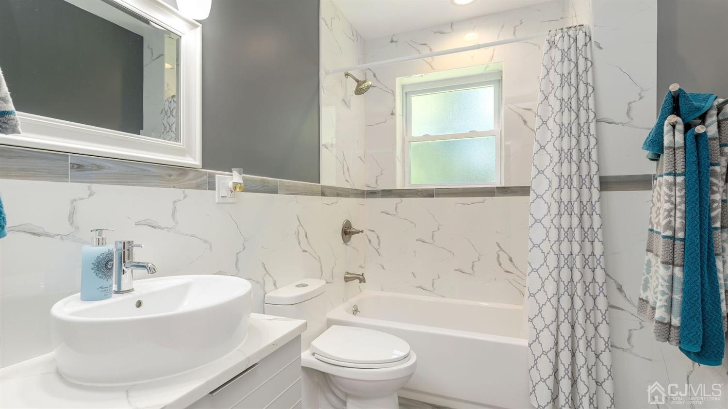 1223 Cushing Road Plainfield, NJ 07062 - Photo 14 of 25 a bathroom with a sink toilet and shower