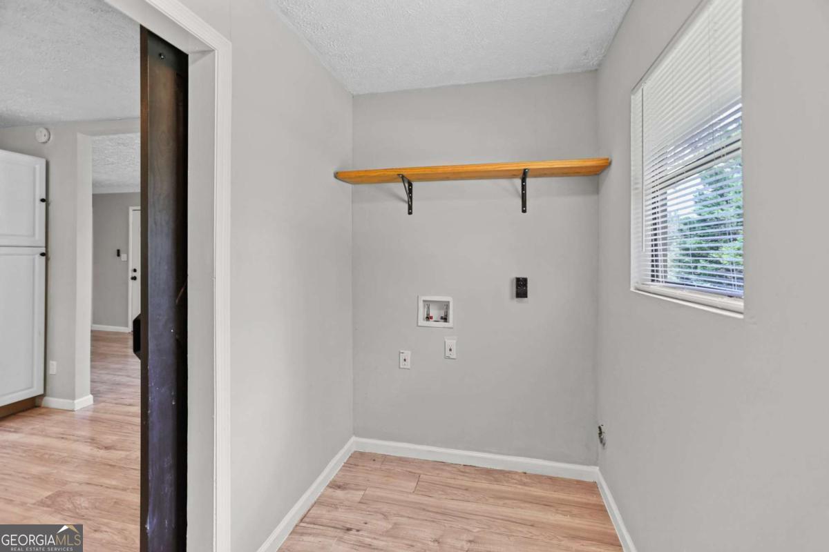 1248 Cannonville Road LaGrange, GA 30240 - Photo 17 of 46 a view of a bedroom with wooden floor and cabinet