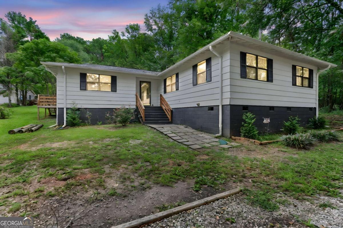 1248 Cannonville Road LaGrange, GA 30240 - Photo 2 of 46 a front view of a house with a yard and garage