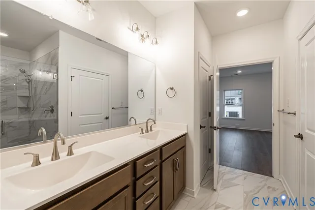 a bathroom with a sink double vanity and a mirror