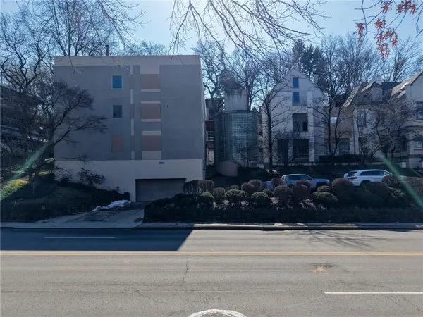 a view of a house with a garden