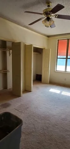 a view of empty room with windows