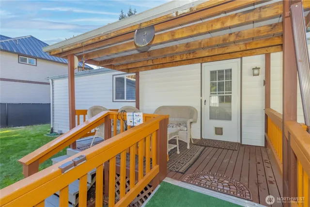 a view of deck with a flat screen tv and a wooden deck
