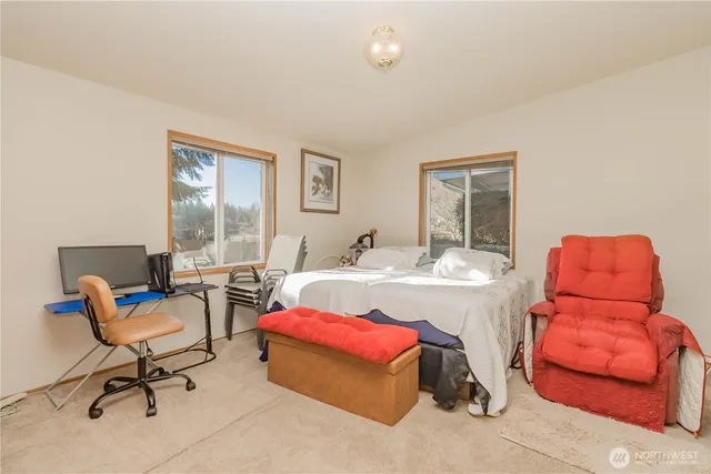 a bed room with furniture and a window