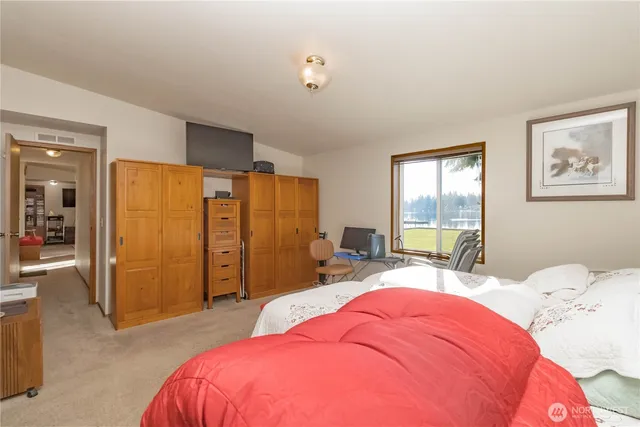 a bed room with a bed and a window