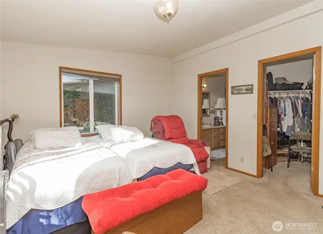 a bedroom with a bed and closet