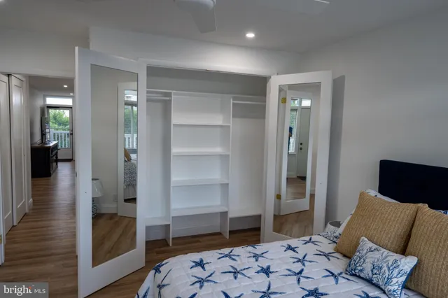 a bedroom with a bed and a walk in closet