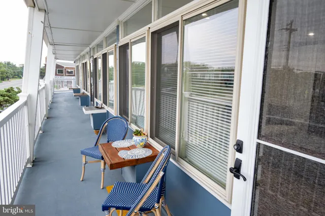 a view of a balcony with chairs