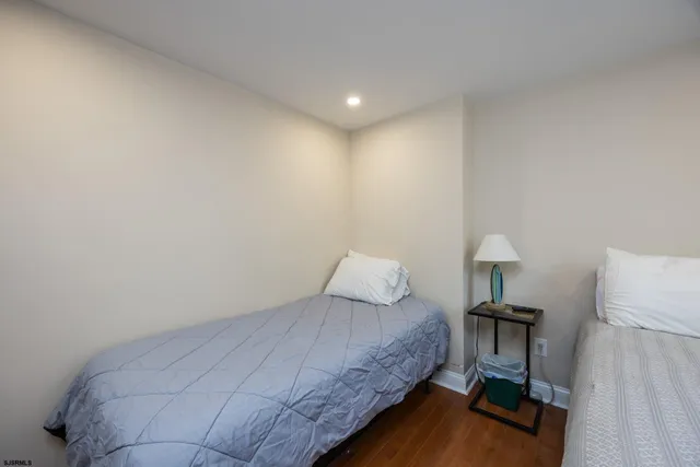 a bedroom with a bed and a lamp