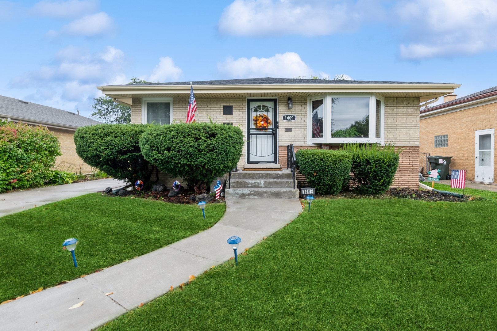 1409 Lahon Street Park Ridge, IL 60068 - Photo 1 of 21 a front view of a house with a yard
