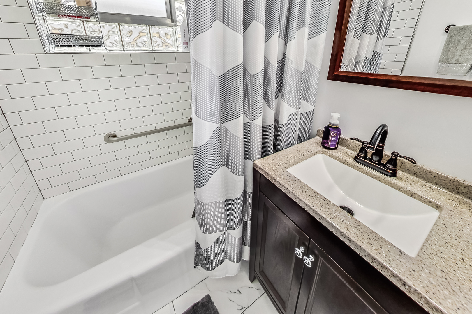 1409 Lahon Street Park Ridge, IL 60068 - Photo 13 of 21 a bathroom with a granite countertop sink a toilet and bathtub