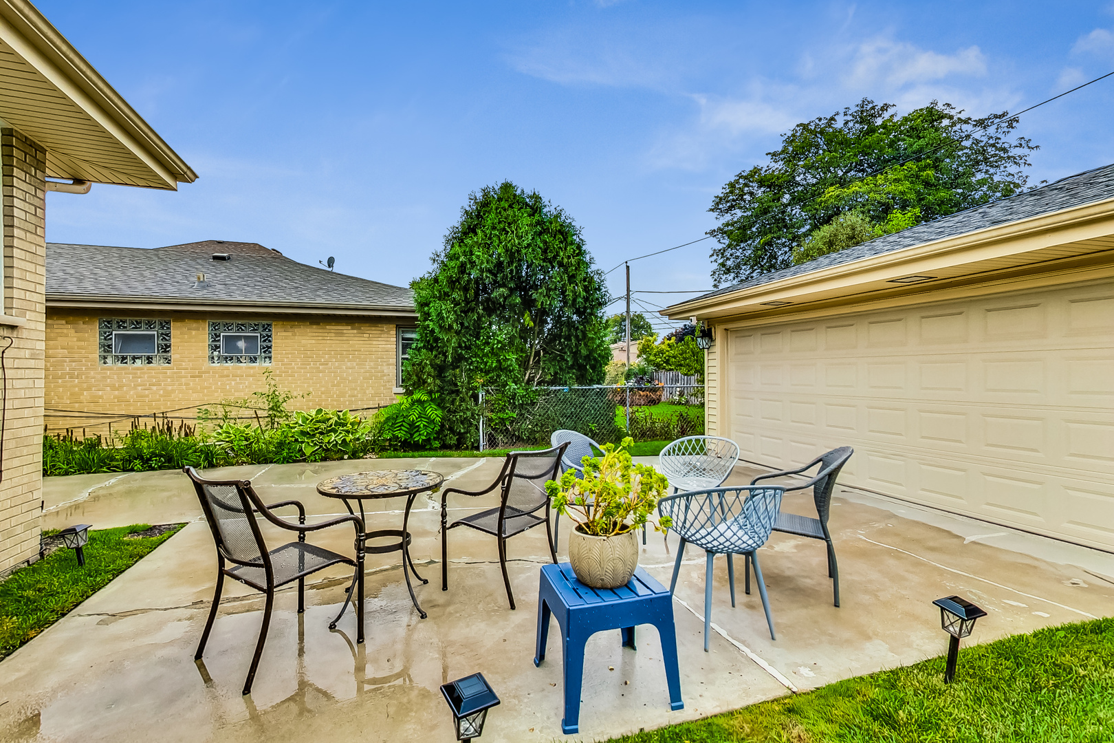 1409 Lahon Street Park Ridge, IL 60068 - Photo 15 of 21 a patio with table and chairs and potted plants