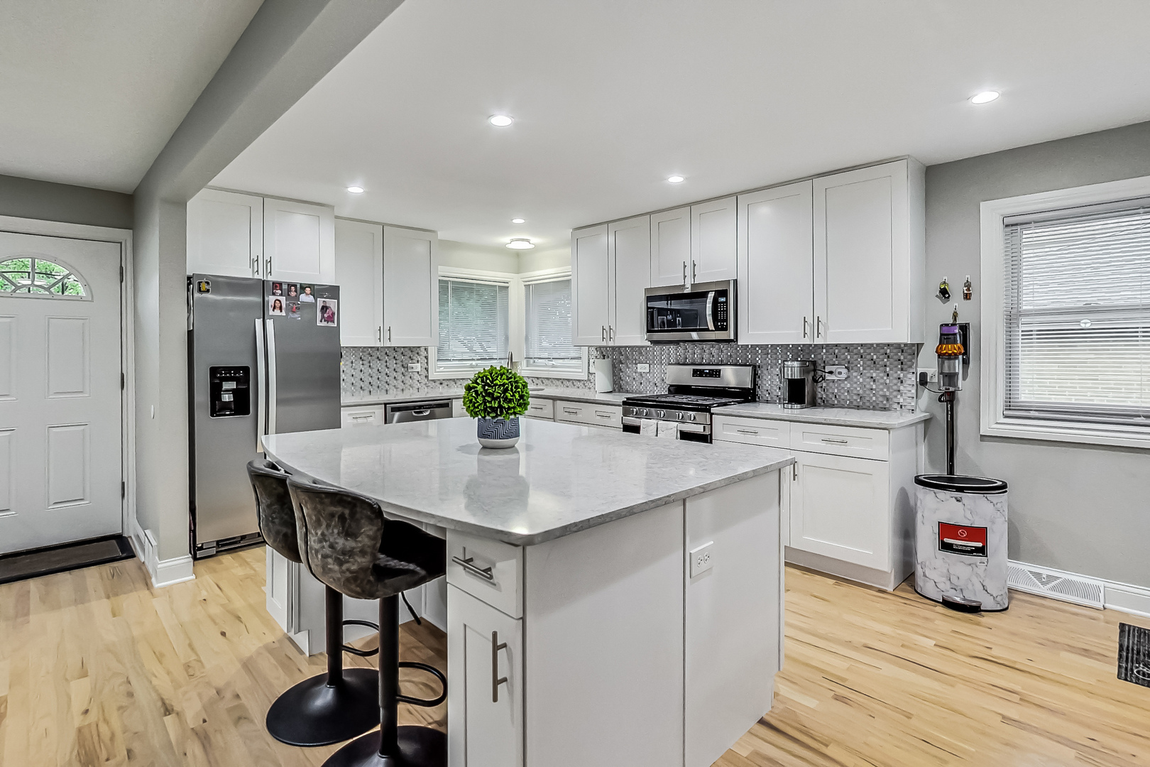 1409 Lahon Street Park Ridge, IL 60068 - Photo 6 of 21 a kitchen with stainless steel appliances a microwave sink refrigerator and cabinets
