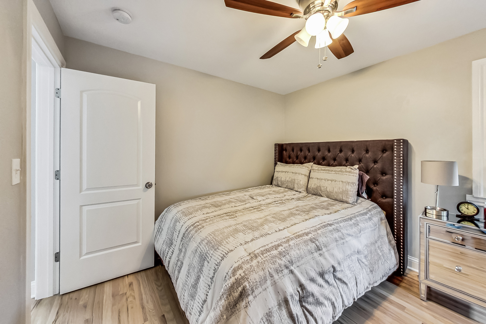 1409 Lahon Street Park Ridge, IL 60068 - Photo 10 of 21 a bedroom with a bed and a chandelier