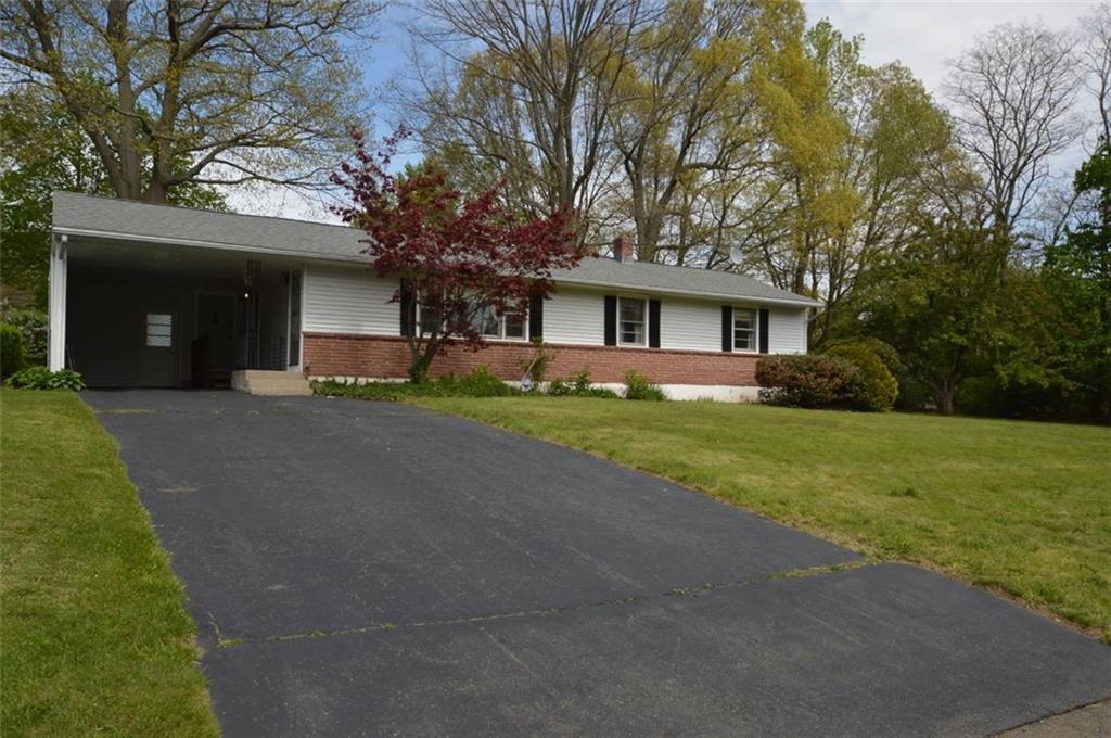 627 6th Ridge Road Wallingford, CT 06492 - Photo 1 of 1 a front view of a house with garden and trees