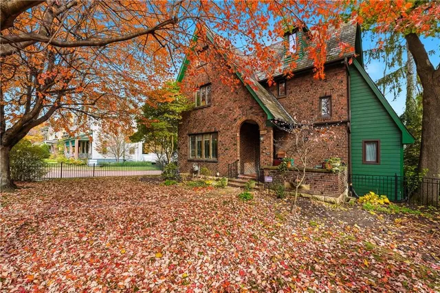 a front view of a house with garden