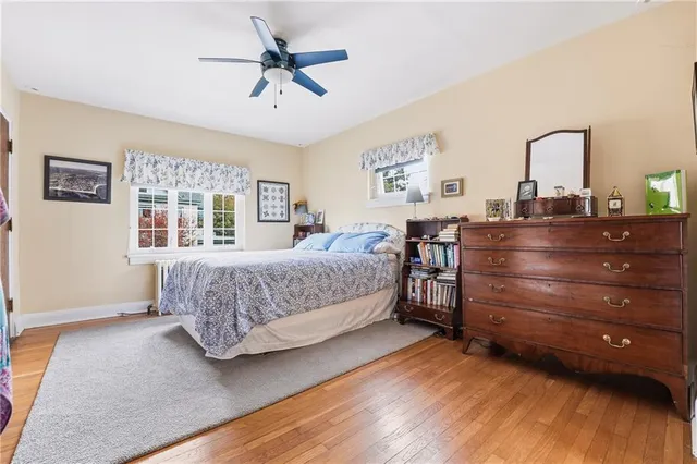 a bedroom with a bed a window and closet