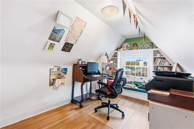 a workspace with furniture hardwood and a window