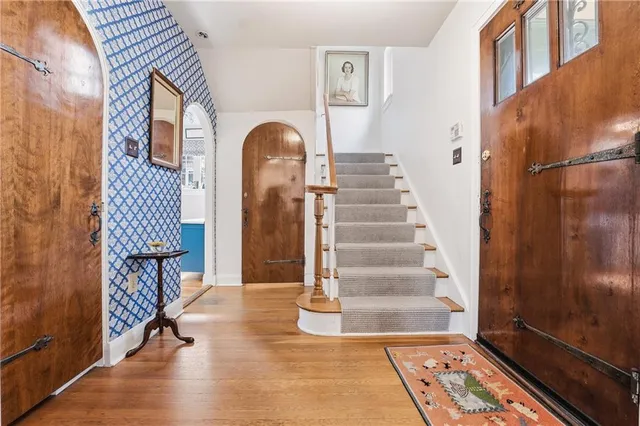 a view of an entryway with wooden floor