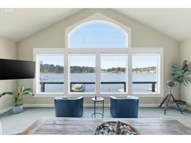 a dining room with furniture window and wooden floor