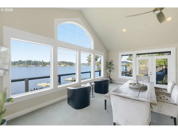 a dining room with furniture and wooden floor