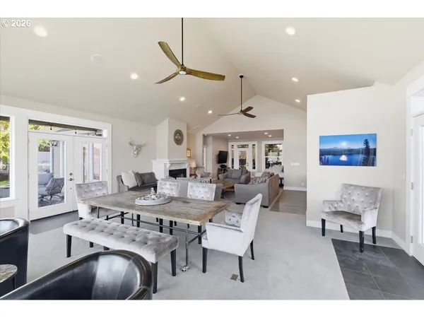 a large kitchen with kitchen island a large counter space a sink appliances and cabinets