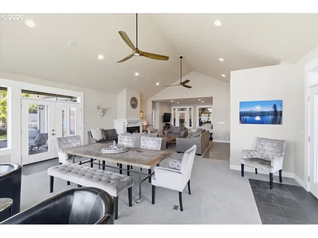 a large kitchen with kitchen island a large counter space a sink appliances and cabinets