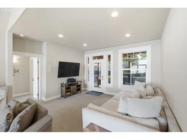 a large kitchen with a table and chairs