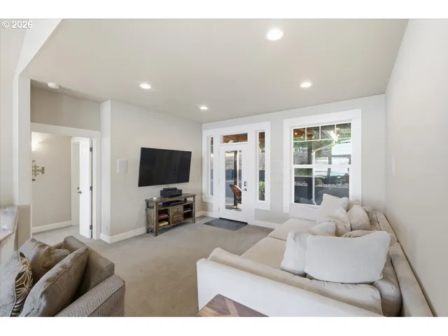 a large kitchen with a table and chairs