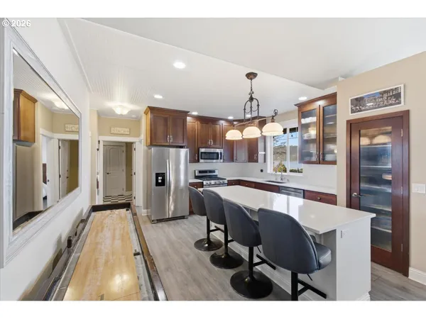 a bedroom with a bed couch and window