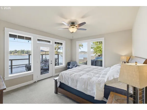 a bathroom with a sink vanity tub and a mirror