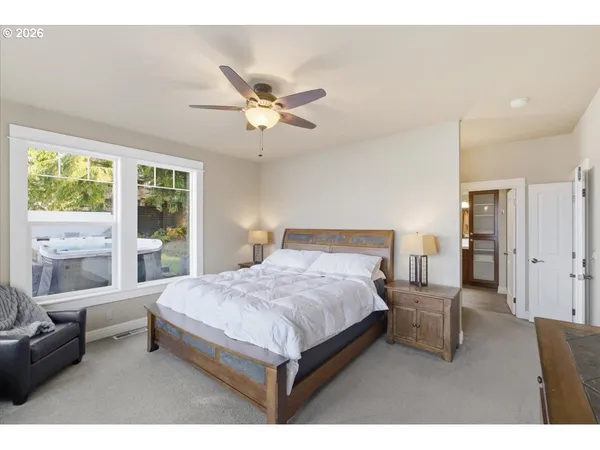 a bathroom with a sink shower and a mirror