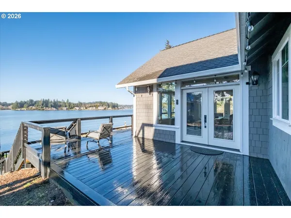 a view of a patio with wooden floor and outdoor seating