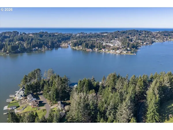 an aerial view of a house with a yard basket ball court and outdoor seating