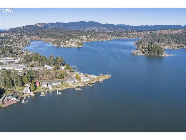 a yellow house with trees in the background