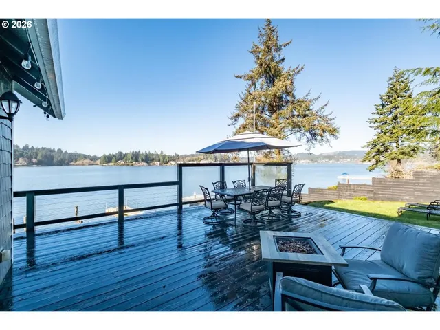 a view of kitchen island with sink and microwave