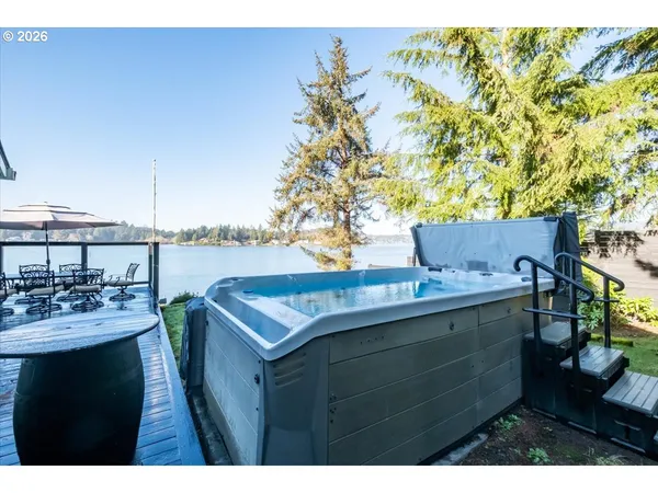 a view of a house with a small yard and wooden floor