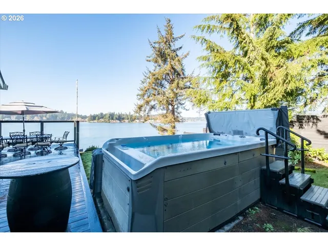 a view of a house with a small yard and wooden floor