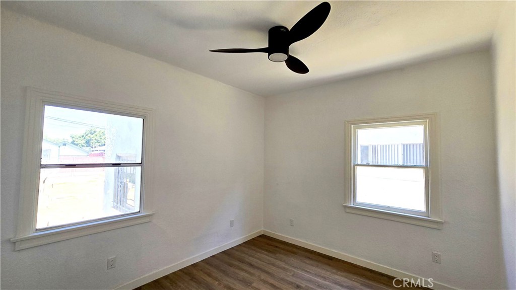 973 North Pk Circle Long Beach, CA 90813 - Photo 5 of 8 a view of empty room with wooden floor and window
