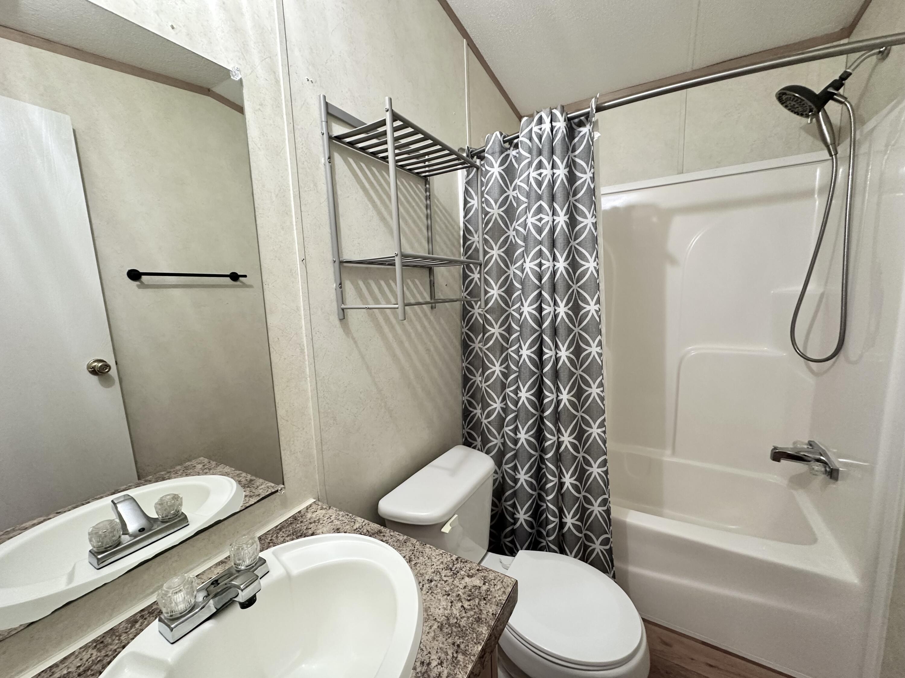 123 Marigold Avenue DeFuniak Springs, FL 32433 - Photo 29 of 45 a bathroom with a sink toilet and shower