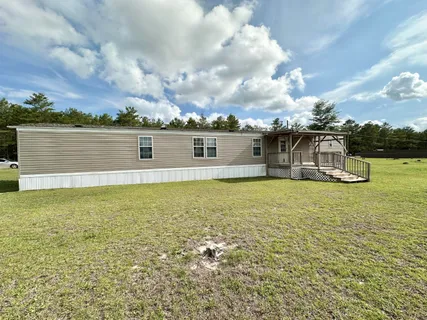a view of a lake with houses in the back