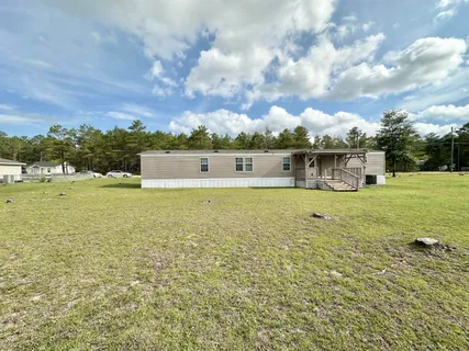a view of a lake with houses in the back
